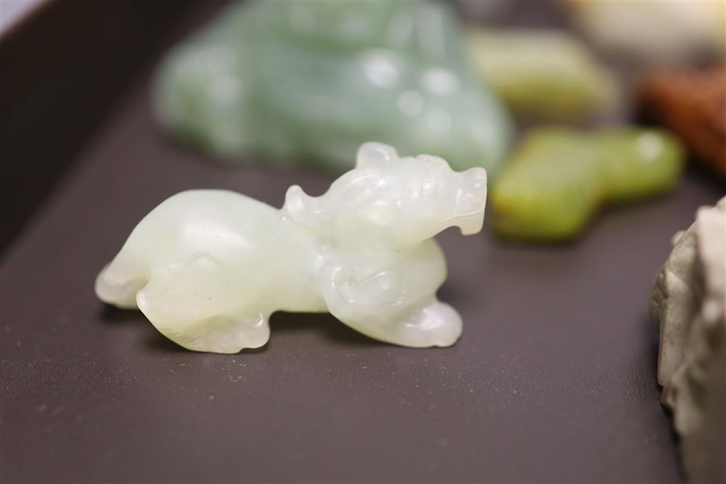 Six Chinese jade and hardstone animal carvings, two dragon belt hooks, a rams head and a soapstone seal, 10cm